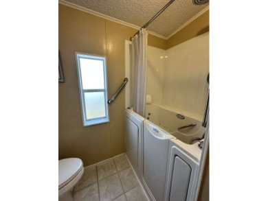 Discover this charming 1996 Homes of Merit "TURNKEY" on Four Lakes Golf Club in Florida - for sale on GolfHomes.com, golf home, golf lot