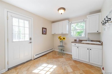 Welcome to this stunning, elegantly updated colonial nestled in on Hilltop Golf Course in Michigan - for sale on GolfHomes.com, golf home, golf lot