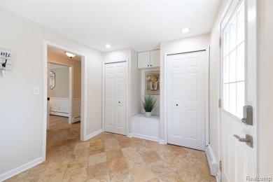 Welcome to this stunning, elegantly updated colonial nestled in on Hilltop Golf Course in Michigan - for sale on GolfHomes.com, golf home, golf lot