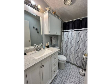 Discover this charming 1996 Homes of Merit "TURNKEY" on Four Lakes Golf Club in Florida - for sale on GolfHomes.com, golf home, golf lot