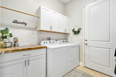 Maintenance-Free Living in Plantation Bay! This beautifully on Plantation Bay Golf and Country Club in Florida - for sale on GolfHomes.com, golf home, golf lot