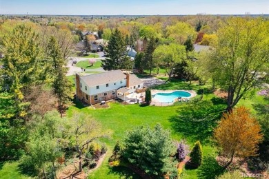 Welcome to this stunning, elegantly updated colonial nestled in on Hilltop Golf Course in Michigan - for sale on GolfHomes.com, golf home, golf lot