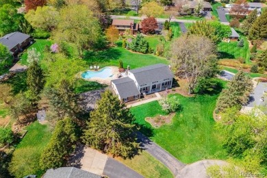 Welcome to this stunning, elegantly updated colonial nestled in on Hilltop Golf Course in Michigan - for sale on GolfHomes.com, golf home, golf lot