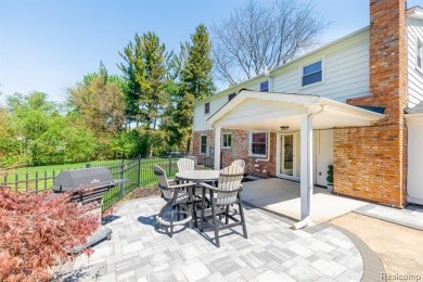Welcome to this stunning, elegantly updated colonial nestled in on Hilltop Golf Course in Michigan - for sale on GolfHomes.com, golf home, golf lot
