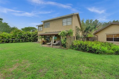 Charming 4-bedroom, 3-bathroom home in the desirable West on Calusa Country Club in Florida - for sale on GolfHomes.com, golf home, golf lot