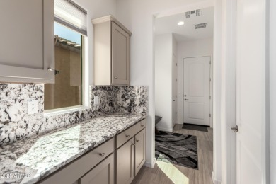 AMAZING RESORT LIVING w/ OPEN WASH VIEWS! Enter this beautifully on Poston Butte Golf Club in Arizona - for sale on GolfHomes.com, golf home, golf lot