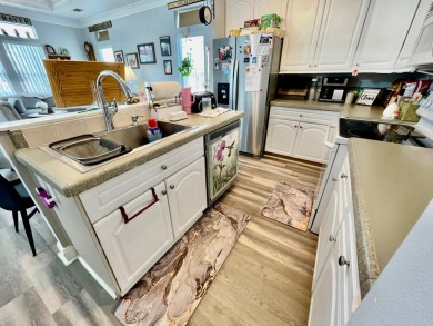 Welcome home to this 2006 Palm Harbor manufactured home located on Golden Lakes Golf Course in Florida - for sale on GolfHomes.com, golf home, golf lot