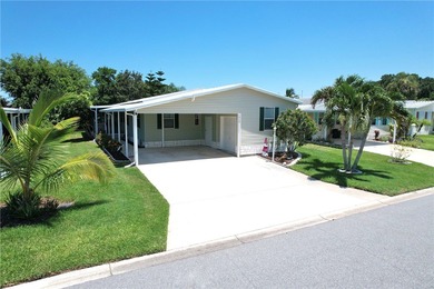 Beautifully maintained home built in 2002, offering over 1,500 on Barefoot Bay Golf Course in Florida - for sale on GolfHomes.com, golf home, golf lot