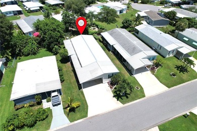 Beautifully maintained home built in 2002, offering over 1,500 on Barefoot Bay Golf Course in Florida - for sale on GolfHomes.com, golf home, golf lot