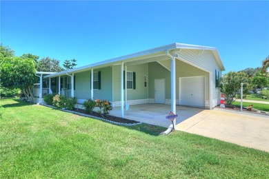 Beautifully maintained home built in 2002, offering over 1,500 on Barefoot Bay Golf Course in Florida - for sale on GolfHomes.com, golf home, golf lot