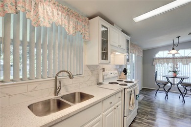 Beautifully maintained home built in 2002, offering over 1,500 on Barefoot Bay Golf Course in Florida - for sale on GolfHomes.com, golf home, golf lot