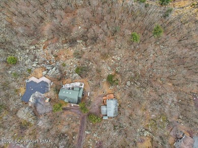 Perched on a private ridge in the sought-after Lake Harmony on Split Rock Resort and Country Club in Pennsylvania - for sale on GolfHomes.com, golf home, golf lot