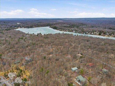 Perched on a private ridge in the sought-after Lake Harmony on Split Rock Resort and Country Club in Pennsylvania - for sale on GolfHomes.com, golf home, golf lot