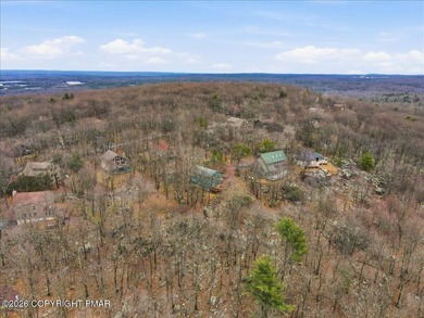 Perched on a private ridge in the sought-after Lake Harmony on Split Rock Resort and Country Club in Pennsylvania - for sale on GolfHomes.com, golf home, golf lot