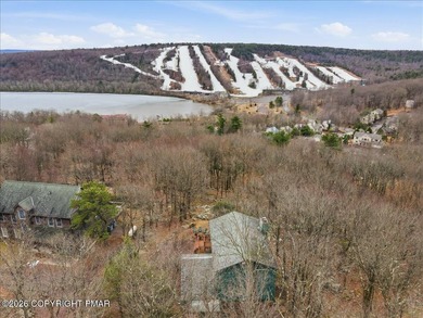 Perched on a private ridge in the sought-after Lake Harmony on Split Rock Resort and Country Club in Pennsylvania - for sale on GolfHomes.com, golf home, golf lot
