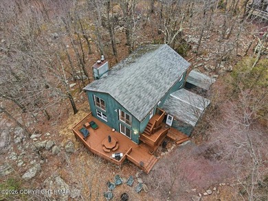 Perched on a private ridge in the sought-after Lake Harmony on Split Rock Resort and Country Club in Pennsylvania - for sale on GolfHomes.com, golf home, golf lot