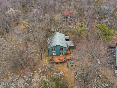 Perched on a private ridge in the sought-after Lake Harmony on Split Rock Resort and Country Club in Pennsylvania - for sale on GolfHomes.com, golf home, golf lot