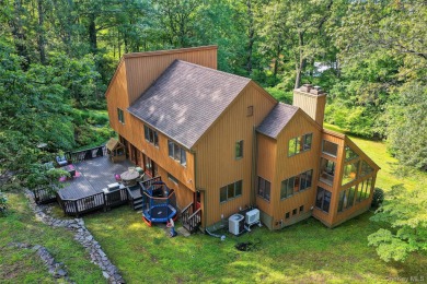 Nestled on nearly two acres of lush, tree-lined property, this on Hudson National Golf Club in New York - for sale on GolfHomes.com, golf home, golf lot