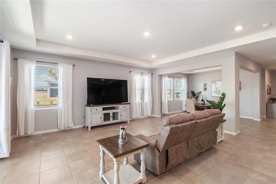 Built in 2023, this eye-catching home has plenty of curb appeal on Trilogy at Ocala Preserve in Florida - for sale on GolfHomes.com, golf home, golf lot