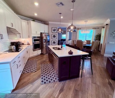 Check out this lovely, five-bedroom, three-bathroom home. This on Woodmont Country Club in Florida - for sale on GolfHomes.com, golf home, golf lot