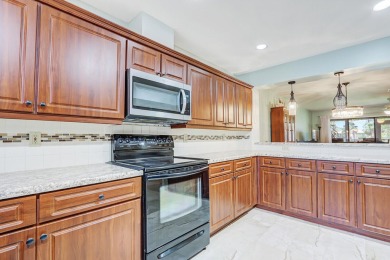 Enjoy peaceful golf course views from this be 2-bedroom, 2-bath on Heritage Ridge Golf Club in Florida - for sale on GolfHomes.com, golf home, golf lot