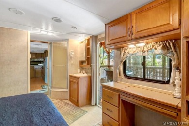 Lake life made easy--and fun! This Lake Gaston camper sits on a on River Ridge Golf Club in Virginia - for sale on GolfHomes.com, golf home, golf lot