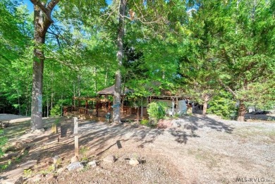 Lake life made easy--and fun! This Lake Gaston camper sits on a on River Ridge Golf Club in Virginia - for sale on GolfHomes.com, golf home, golf lot