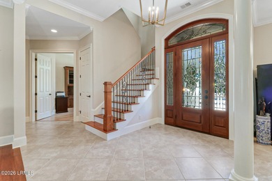 Boasting expansive golf views of the famed North Course at on Berkeley Hall Golf Club in South Carolina - for sale on GolfHomes.com, golf home, golf lot