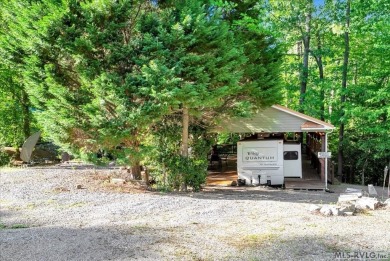 Lake life made easy--and fun! This Lake Gaston camper sits on a on River Ridge Golf Club in Virginia - for sale on GolfHomes.com, golf home, golf lot