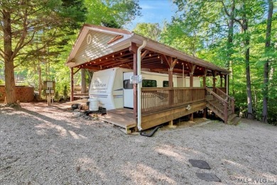 Lake life made easy--and fun! This Lake Gaston camper sits on a on River Ridge Golf Club in Virginia - for sale on GolfHomes.com, golf home, golf lot