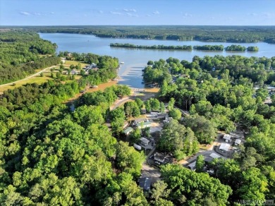 Lake life made easy--and fun! This Lake Gaston camper sits on a on River Ridge Golf Club in Virginia - for sale on GolfHomes.com, golf home, golf lot