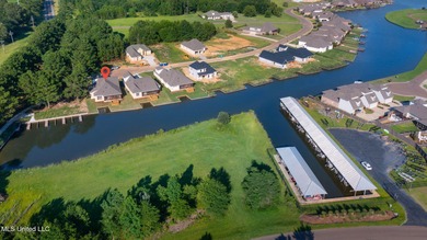 EXPERIENCE WATERFRONT LIVING AT ITS FINEST IN BEAUTIFUL LAKE on Lake Caroline Golf Club in Mississippi - for sale on GolfHomes.com, golf home, golf lot