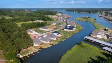 EXPERIENCE WATERFRONT LIVING AT ITS FINEST IN BEAUTIFUL LAKE on Lake Caroline Golf Club in Mississippi - for sale on GolfHomes.com, golf home, golf lot