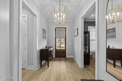 EXPERIENCE WATERFRONT LIVING AT ITS FINEST IN BEAUTIFUL LAKE on Lake Caroline Golf Club in Mississippi - for sale on GolfHomes.com, golf home, golf lot