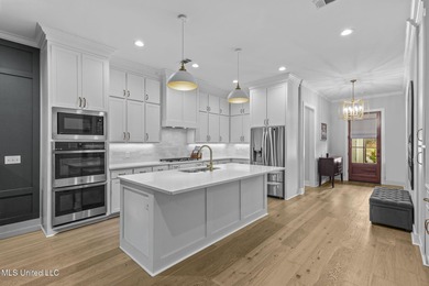 EXPERIENCE WATERFRONT LIVING AT ITS FINEST IN BEAUTIFUL LAKE on Lake Caroline Golf Club in Mississippi - for sale on GolfHomes.com, golf home, golf lot