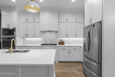 EXPERIENCE WATERFRONT LIVING AT ITS FINEST IN BEAUTIFUL LAKE on Lake Caroline Golf Club in Mississippi - for sale on GolfHomes.com, golf home, golf lot