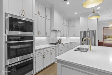 EXPERIENCE WATERFRONT LIVING AT ITS FINEST IN BEAUTIFUL LAKE on Lake Caroline Golf Club in Mississippi - for sale on GolfHomes.com, golf home, golf lot