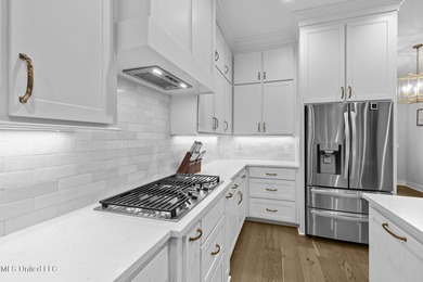 EXPERIENCE WATERFRONT LIVING AT ITS FINEST IN BEAUTIFUL LAKE on Lake Caroline Golf Club in Mississippi - for sale on GolfHomes.com, golf home, golf lot