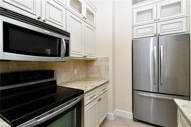 Indulge in resort-style luxury at this stunning top-floor end on Lely Resort Golf and Country Club in Florida - for sale on GolfHomes.com, golf home, golf lot