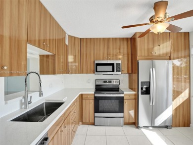 Just reduced. Pristine second floor condo in the gated community on Wynmoor Golf Course in Florida - for sale on GolfHomes.com, golf home, golf lot