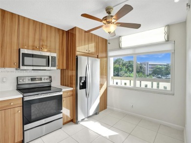 Just reduced. Pristine second floor condo in the gated community on Wynmoor Golf Course in Florida - for sale on GolfHomes.com, golf home, golf lot