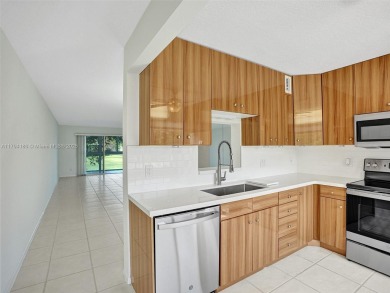 Just reduced. Pristine second floor condo in the gated community on Wynmoor Golf Course in Florida - for sale on GolfHomes.com, golf home, golf lot