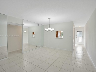 Just reduced. Pristine second floor condo in the gated community on Wynmoor Golf Course in Florida - for sale on GolfHomes.com, golf home, golf lot