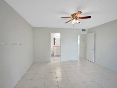 Just reduced. Pristine second floor condo in the gated community on Wynmoor Golf Course in Florida - for sale on GolfHomes.com, golf home, golf lot