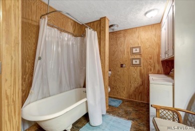 Cute A-frame tucked in the woods at the end of a cul-de-sac on Tanglewood Shores Golf Club in Virginia - for sale on GolfHomes.com, golf home, golf lot