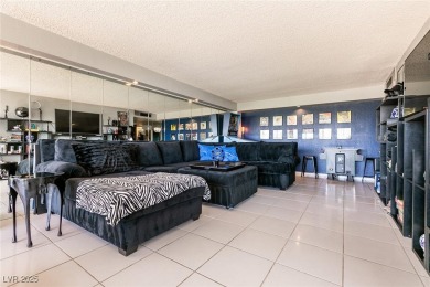 Experience elevated living in this 9th-floor high-rise unit on Las Vegas Country Club in Nevada - for sale on GolfHomes.com, golf home, golf lot