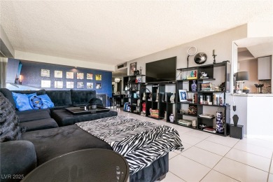 Experience elevated living in this 9th-floor high-rise unit on Las Vegas Country Club in Nevada - for sale on GolfHomes.com, golf home, golf lot