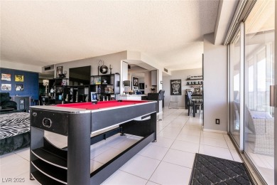 Experience elevated living in this 9th-floor high-rise unit on Las Vegas Country Club in Nevada - for sale on GolfHomes.com, golf home, golf lot