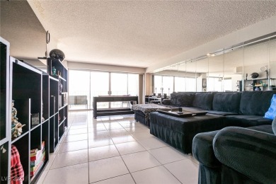 Experience elevated living in this 9th-floor high-rise unit on Las Vegas Country Club in Nevada - for sale on GolfHomes.com, golf home, golf lot