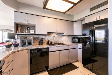 Experience elevated living in this 9th-floor high-rise unit on Las Vegas Country Club in Nevada - for sale on GolfHomes.com, golf home, golf lot